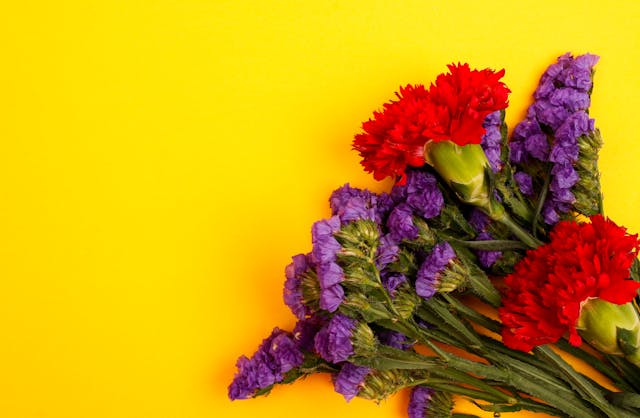Vibrant purple statice flowers bunched together in a floral arrangement
